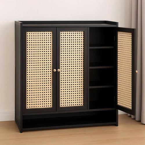 This black storage cabinet features natural rattan doors and open shelving for a stylish blend of texture and function.