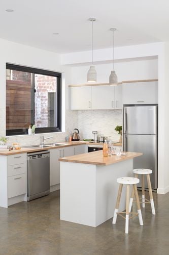 Modern kitchen with timber benchtops and kitchen island with stools