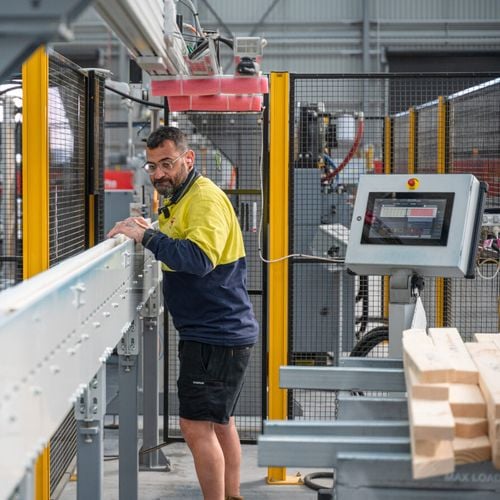Bunnings team member working inside with machinery
