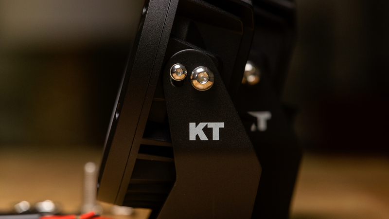 Side detail of KT 7'' LED driving light housing and mounting bracket.