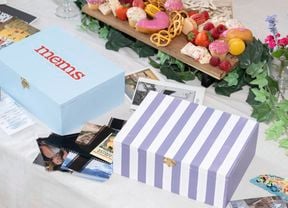 Decorated memory boxes featuring painted base colours, patterns and lettering to store photos, tickets and keepsakes.