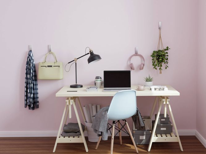 3M Command Hooks used to organise a home office workspace, holding a bag, headphones and hanging plant above a desk.
