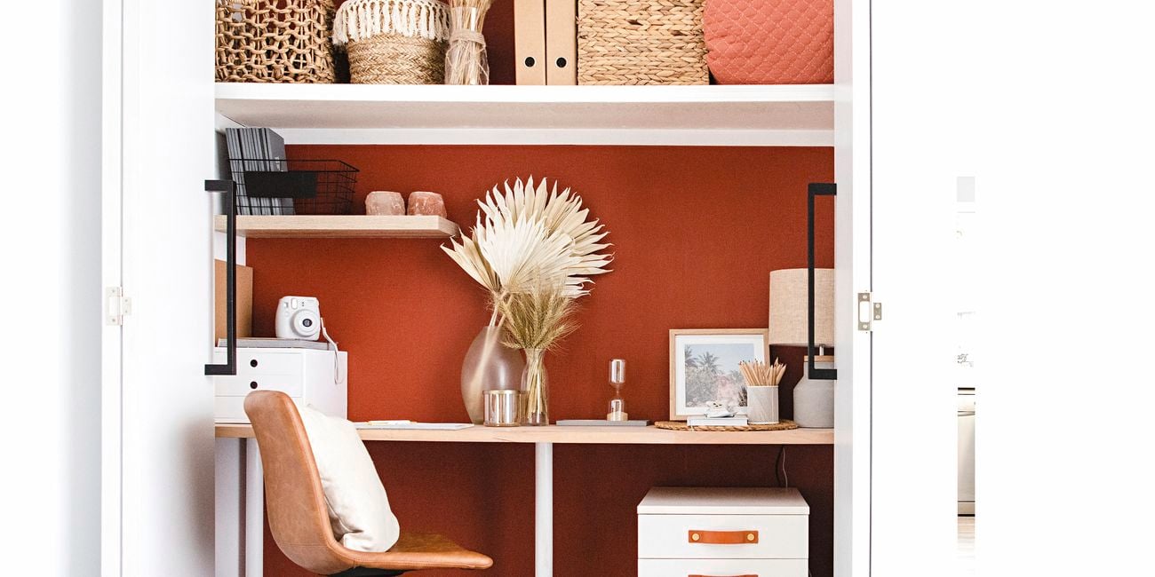 Study space in a cupboard with a timber desk, 