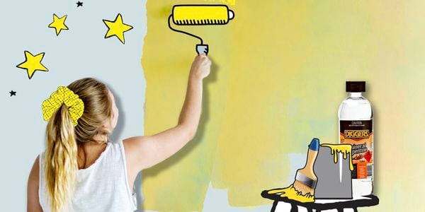 Person using paint roller with diggers products in shot