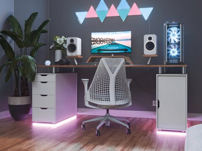 9 smart light panel layout mounted onto a wall behind a gaming setup.