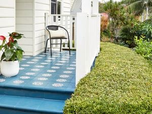 Blue tiles Stencilled pathway leading up to the front door, with white timber railing