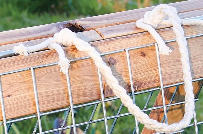 Top of timber and steel mesh growing frame with rope handle