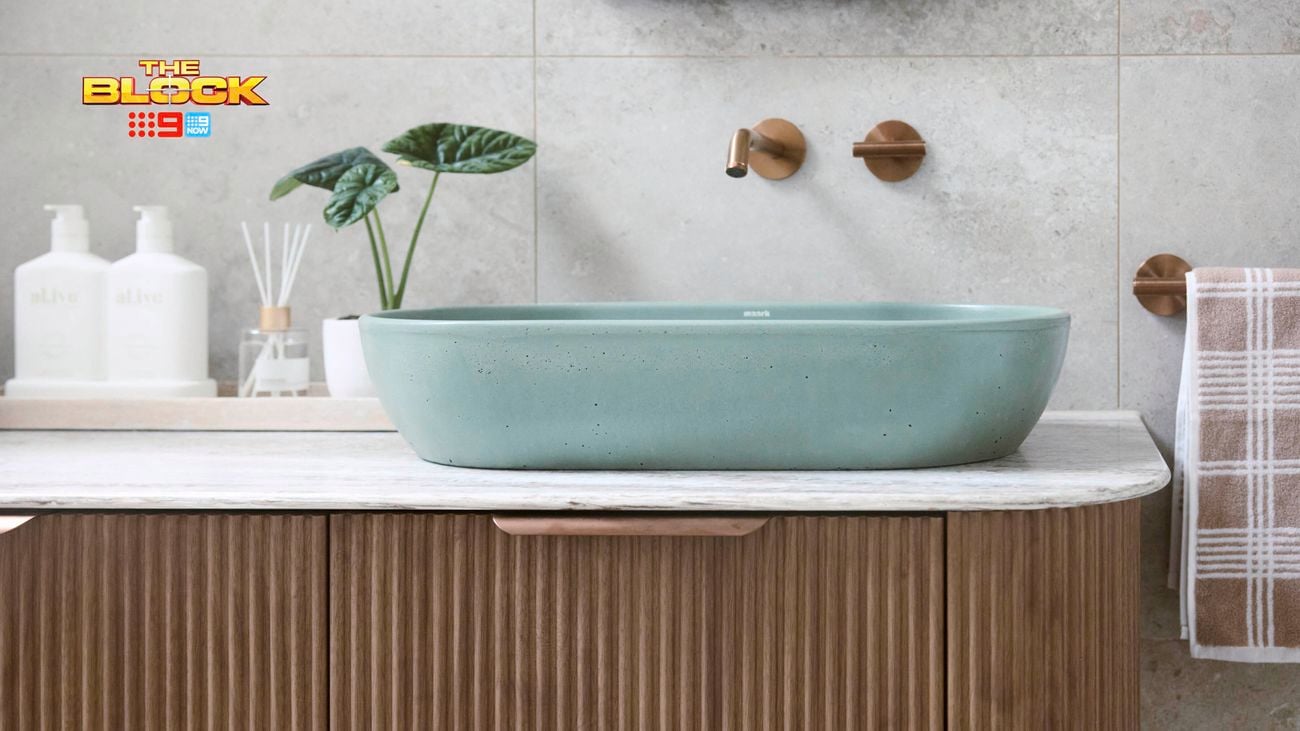 Blue oval basin on a brown timber fluted profile
