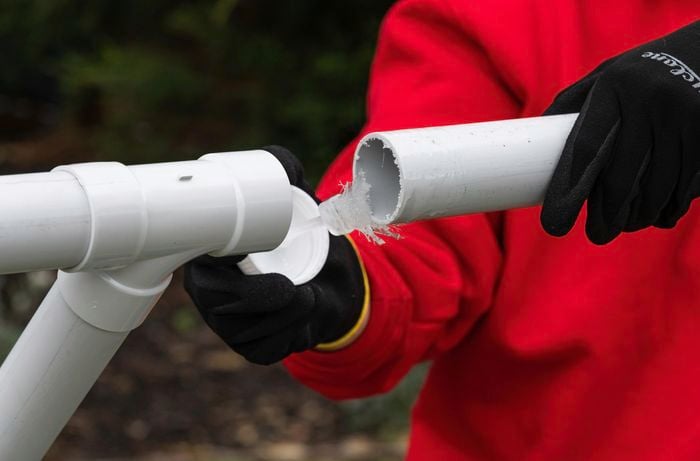 using plumbing cement to join pvc pipes together