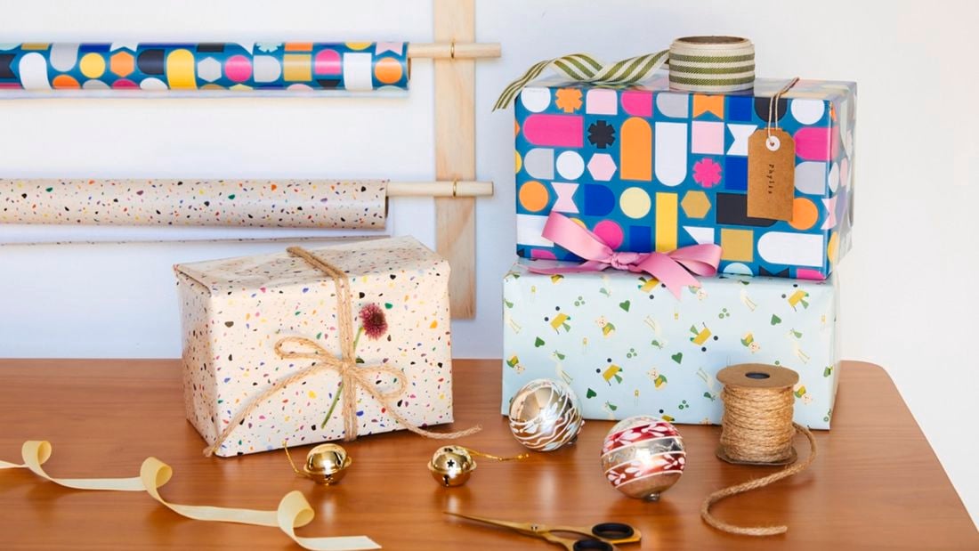 Wrappped presents in front of wrapping station