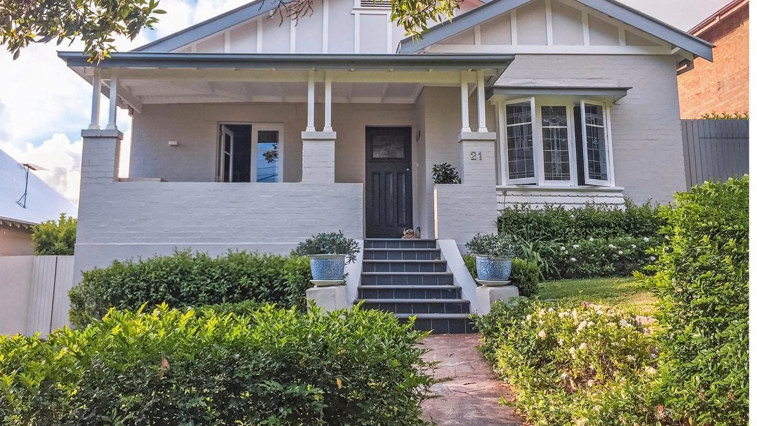 California bungalow style home with windows open