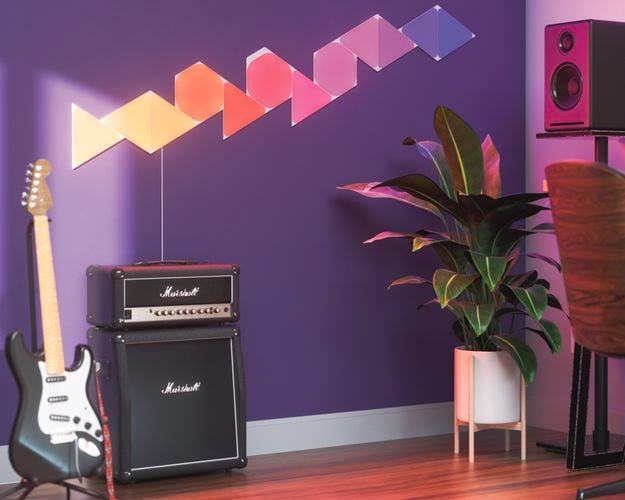 12 smart light panel layout mounted onto a wall in a music room.