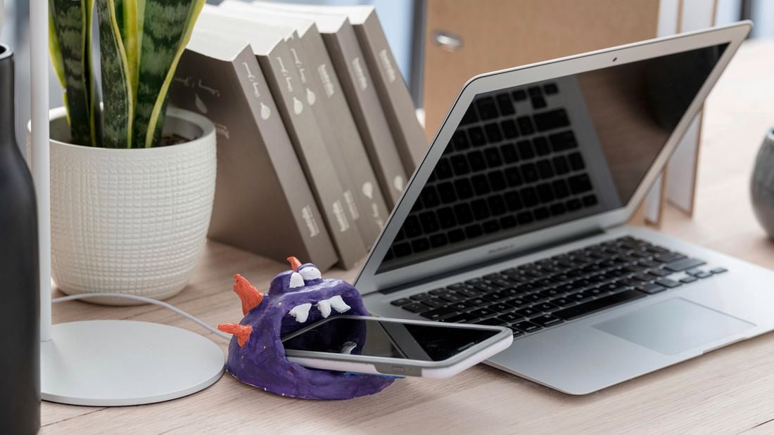 A monster themed smartphone holder in situ