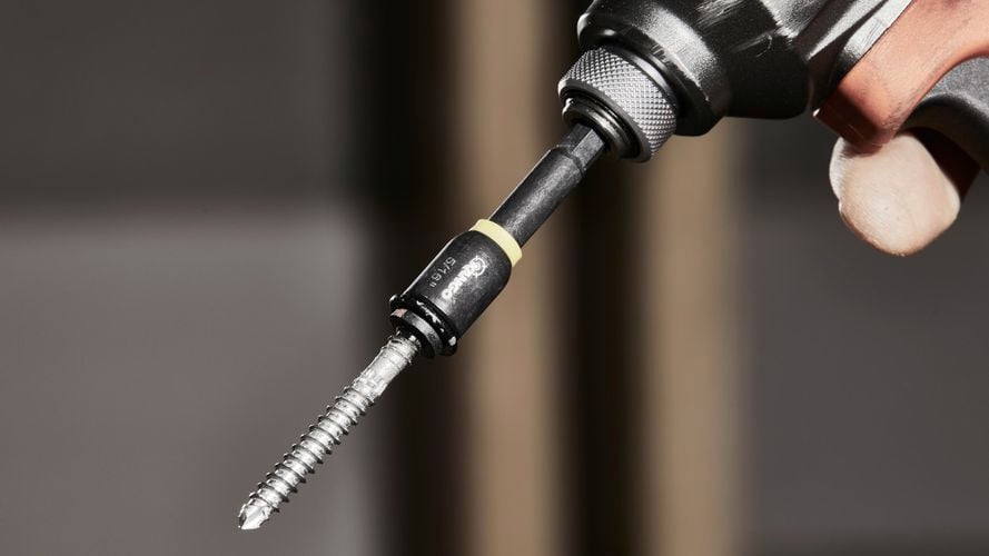 Drill machine with nail fixed to the tip.