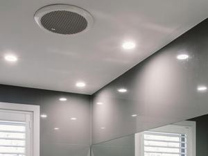 Bathroom with a grey marble colour scheme and downlights