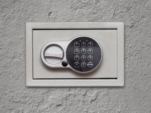 Safe installed on a concrete wall