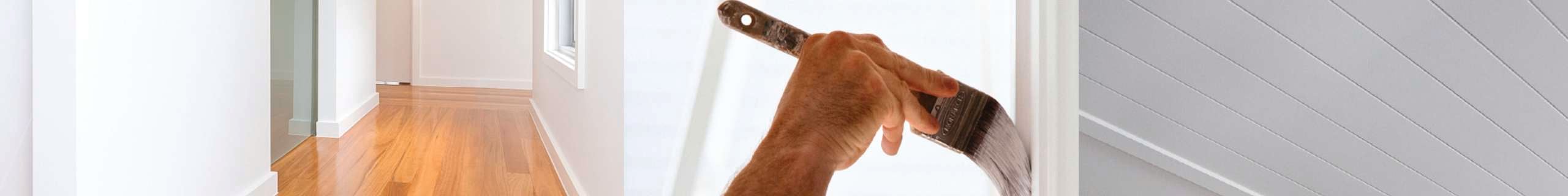 Paint brush painting skirting of door