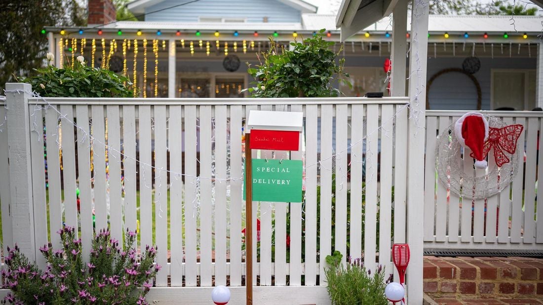 Letterbox with a santa sign out the front of a house