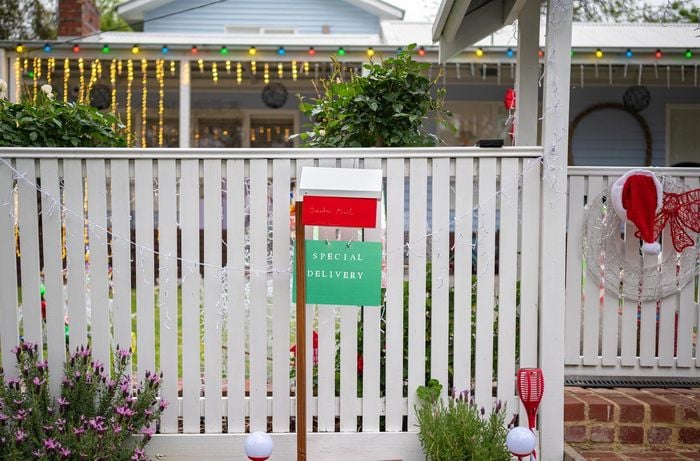 Letterbox with a santa sign out the front of a house