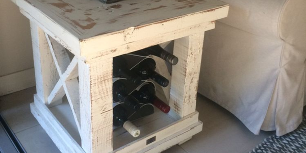 A distressed look side table in a living area