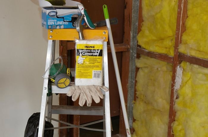 Tools and materials required for this project, including disposable coveralls