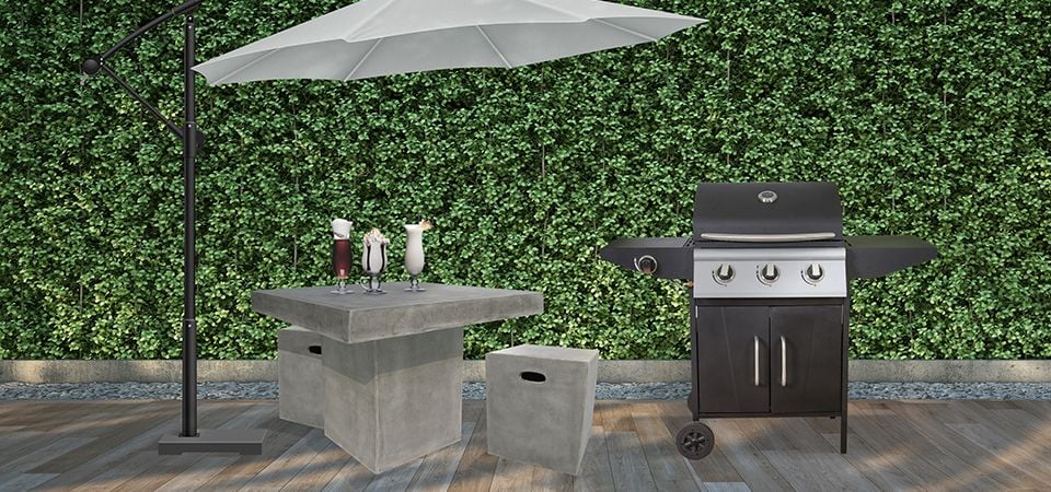 Deck with BBQ, outdoor table and cube seats and cantilever umbrella
