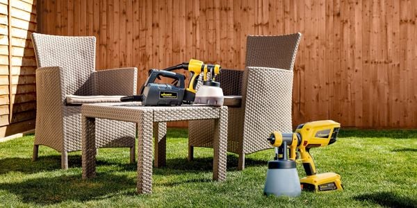 Outdoor setting with Wagner spray guns displayed.