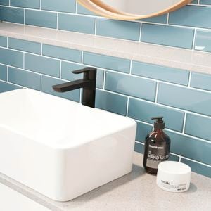 Black matte tap with white bathroom basin 