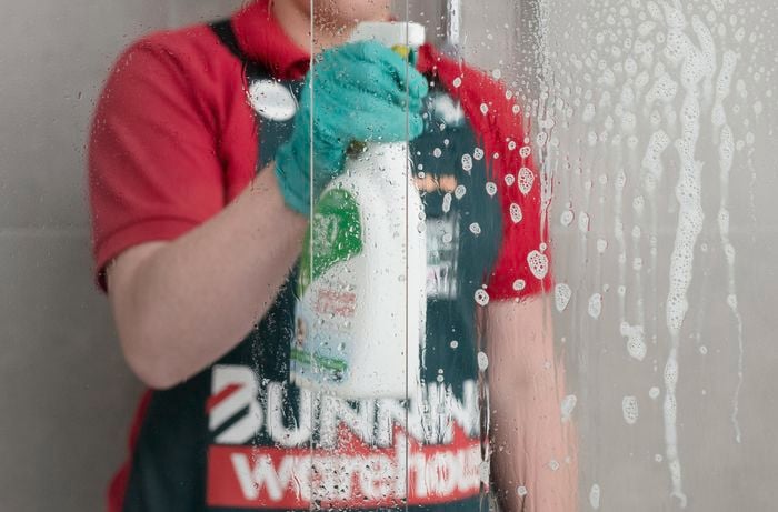 spraying of shower cleaner