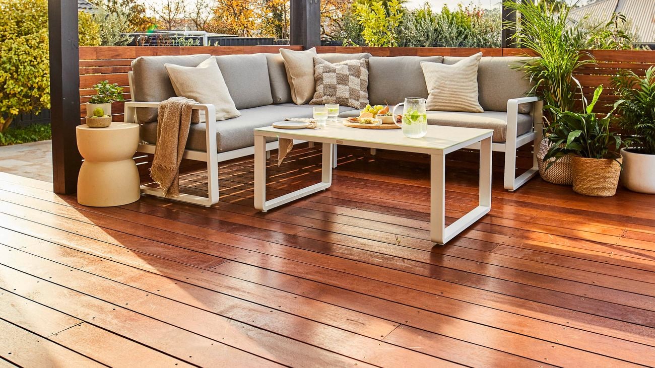 Outdoor entertaining area with timber decking and an outdoor setting on it.