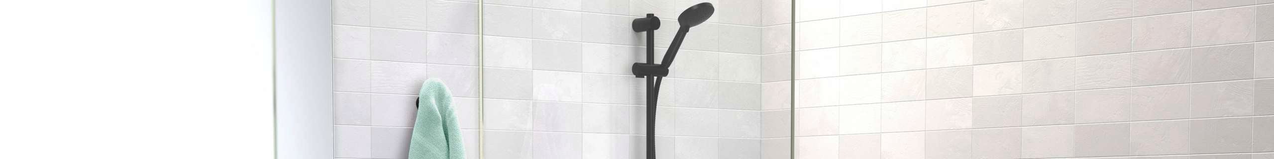 Matte black flexispray shower head with green towel