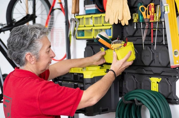 A Bunnings Team Member is installing tool holders for fast, secure access to everyday gear without taking up bench space  