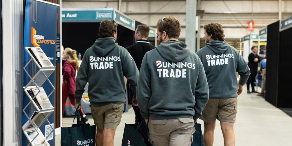 Three tradies wearing our trade bunnings hoodies