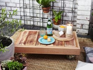 DIY Step Image - D.I.Y. outdoor pallet coffee table on wheels . Blob storage upload.
