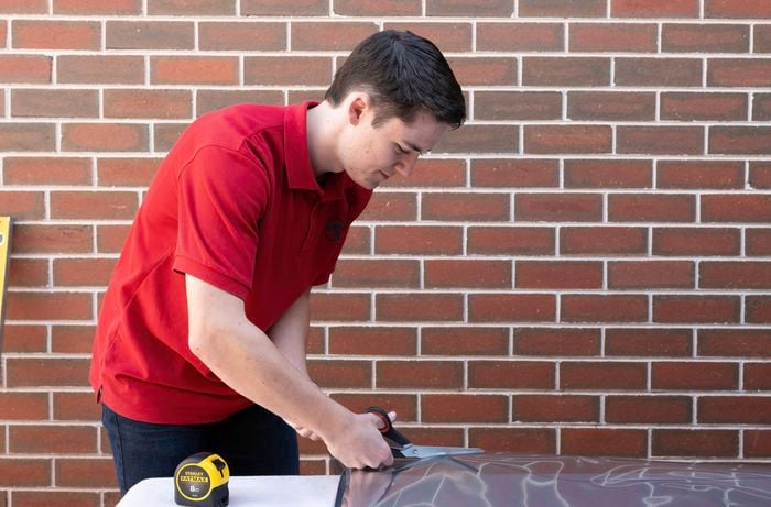 Cut the window film sheet using scissors