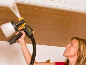 Using paint sprayer to paint walls