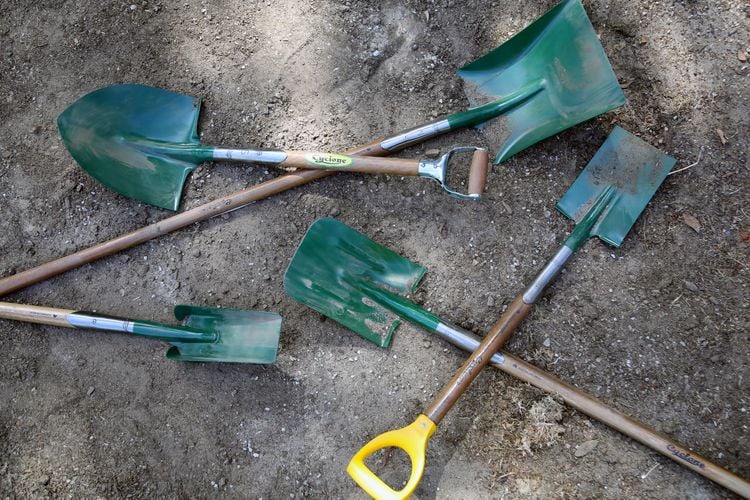 Various Cyclone shovels and spades on the ground