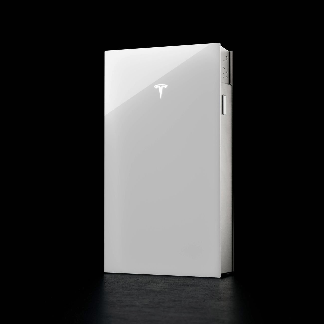 A white Tesla Powerwall battery unit with a sleek, glossy finish and the Tesla logo on the front.
