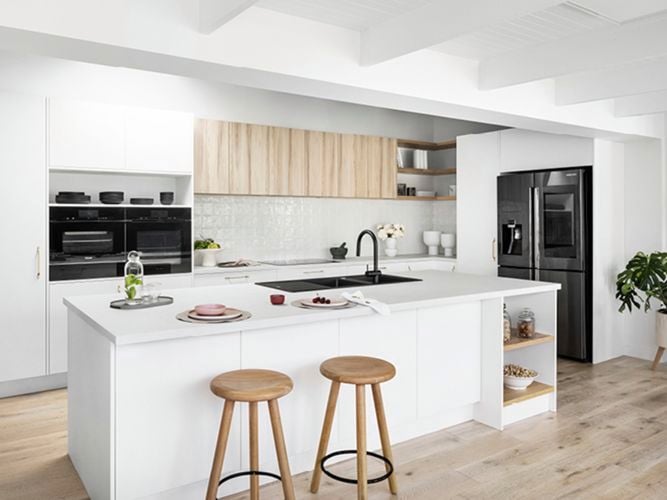 Whie kitchen with timber stools and timber floorig