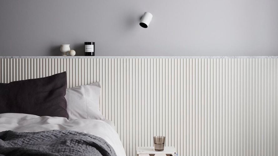 Bedroom complemented with black, white and grey bed linen and accessories. Scallop 22.5 design in Dulux Natural White and top wall in Dulux Silkwort