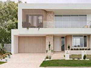A modern house with cladding and a white exterior.