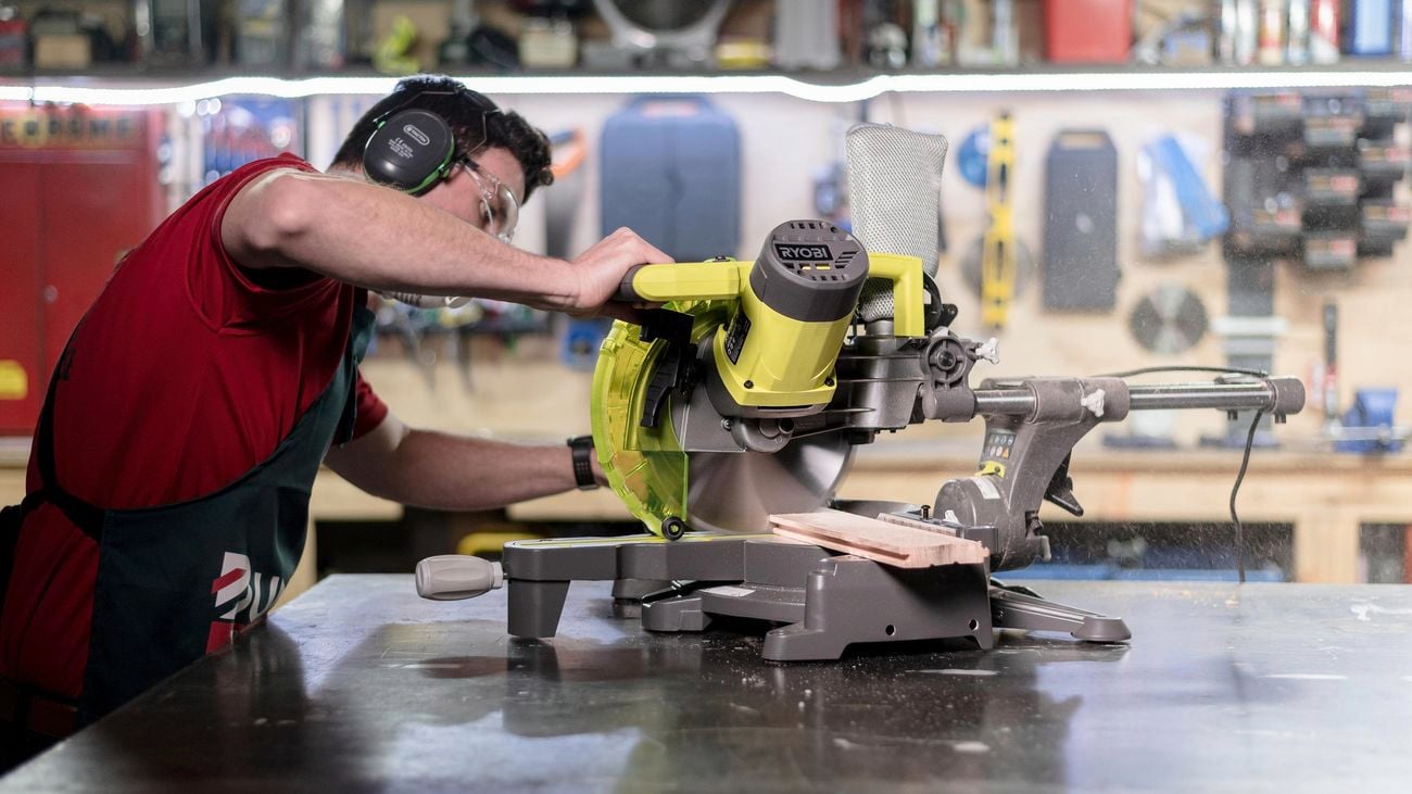 TM showing how to use a mitre  saw
