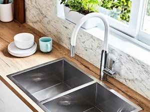 Chrome sink and white tapware.