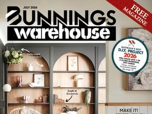 Bunnings Warehouse July 2026 magazine cover showing a styled living room with built-in arched shelving, home décor, indoor plants and a small dog, with headlines about DIY projects, home updates and winter tips.