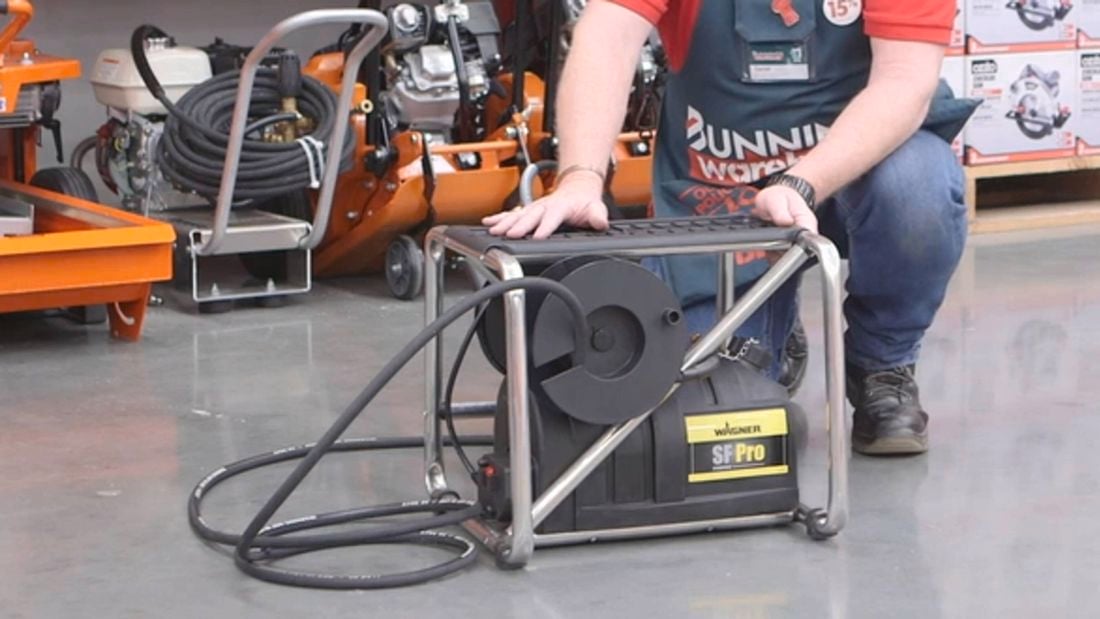 Wall Paper steamer from the Bunnings Hireshop with a Bunnings team member behind the machine. 