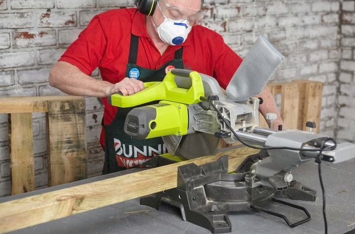 A circular saw being used to cut a length of timber