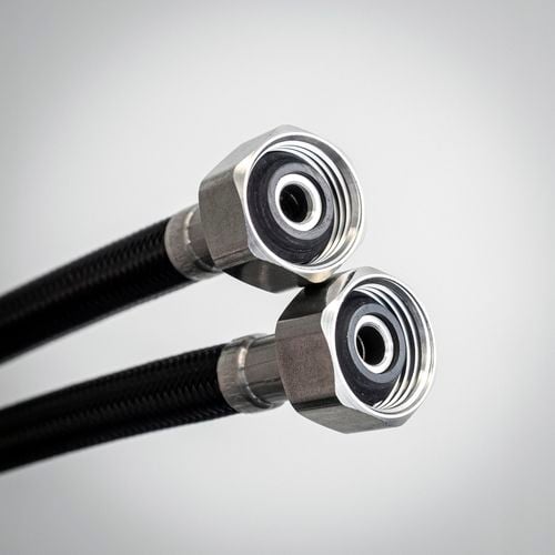 A close up of two water connectors.
