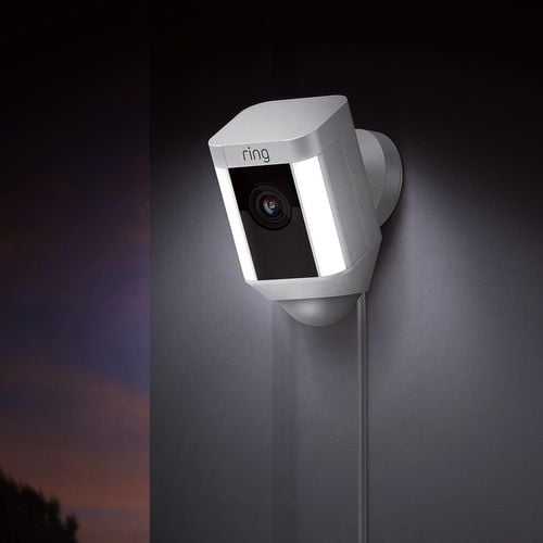 Security camera mounted on an outside wall at night