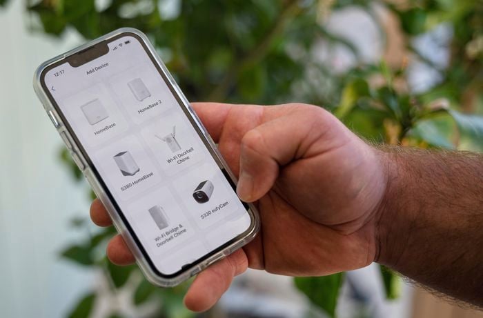 A person viewing security camera app in his mobile.