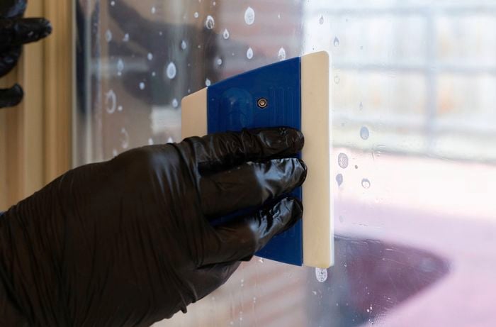 Use a squeegee to remove air bubbles